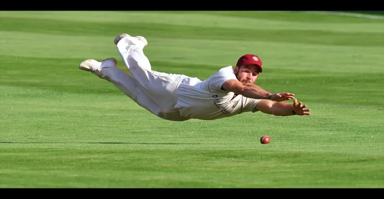 1st Fielder In Full Flight by Simon Coates